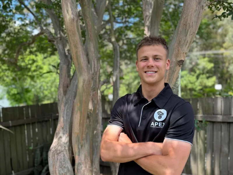 A friendly APEX team member in branded uniform on the Central Coast